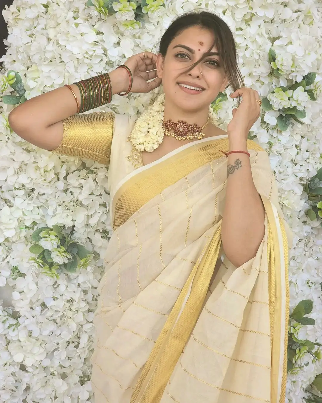 Anusree Nair Wearing Beautiful Earrings Jewellery White Pattu Saree